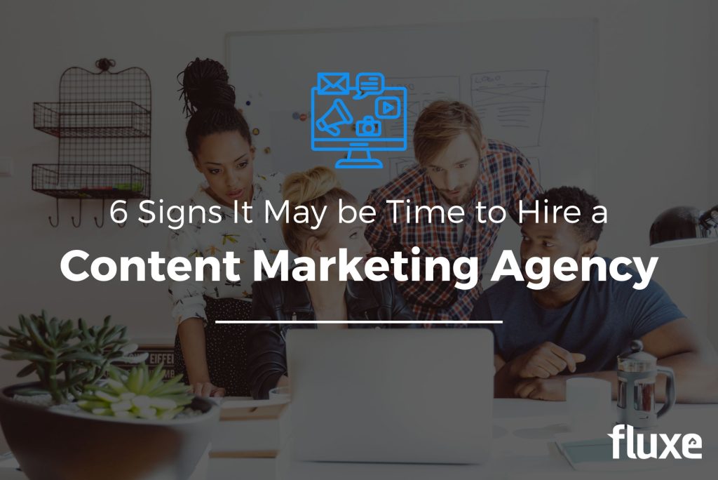 A marketing agency team works on content after being hired by a business.